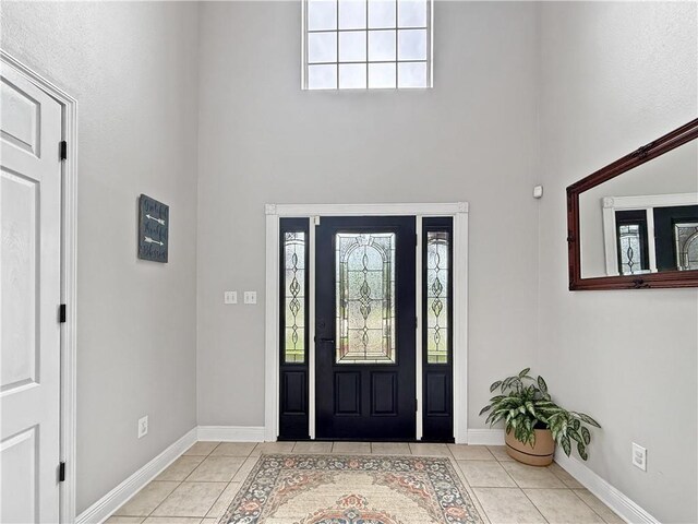 2009 Rubich Ln, Slidell, LA 70461 - foyer entrance featuring a towering ceiling, tile patterned flooring, and healthy amount of natural light