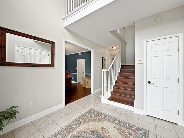 2009 Rubich Ln, Slidell, LA 70461 - entrance foyer featuring light tile patterned floors and stairs