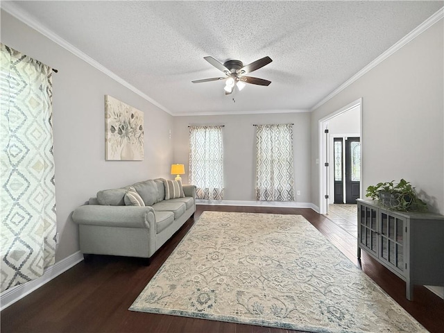 2009 Rubich Ln, Slidell, LA 70461 - living area with a ceiling fan, healthy amount of natural light, dark wood-type flooring, crown molding, and a textured ceiling