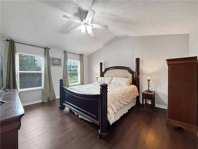 2009 Rubich Ln, Slidell, LA 70461 - bedroom featuring dark wood-style flooring, vaulted ceiling, a ceiling fan, and a textured ceiling
