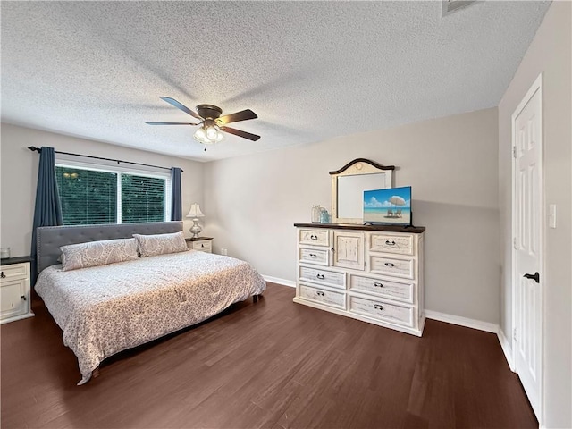 2009 Rubich Ln, Slidell, LA 70461 - bedroom featuring dark wood-style flooring, a textured ceiling, and ceiling fan