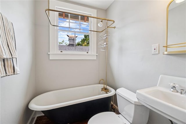 1016 Constantinople St, New Orleans, LA 70115 - bathroom with a freestanding bath and toilet