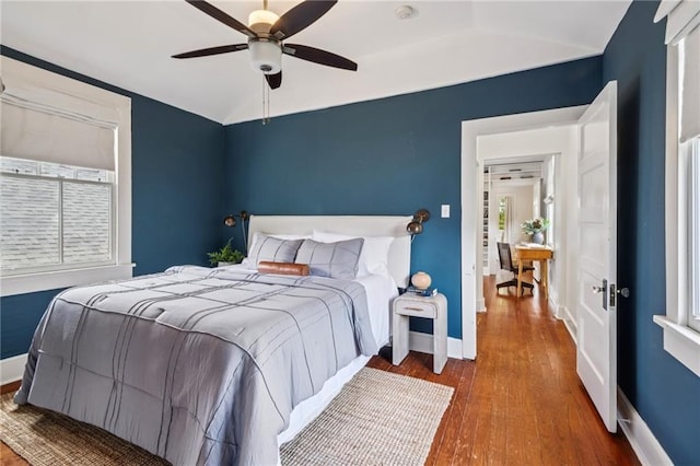1016 Constantinople St, New Orleans, LA 70115 - bedroom featuring wood finished floors, vaulted ceiling, and ceiling fan