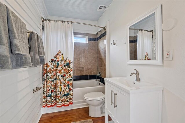 1016 Constantinople St, New Orleans, LA 70115 - full bathroom featuring vanity, shower / tub combo with curtain, and wood finished floors
