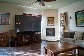 78028 N Fitzmorris Ext, Covington, LA 70435 - living room featuring ceiling fan, a glass covered fireplace, and wood finished floors