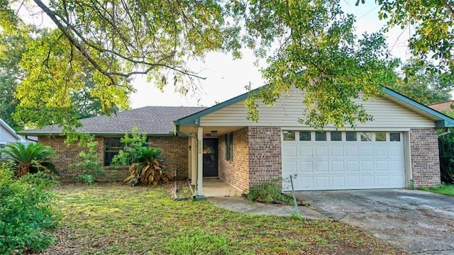 232 Lake Village Blvd, Slidell, LA 70461 - ranch-style house featuring brick siding, driveway, and a garage