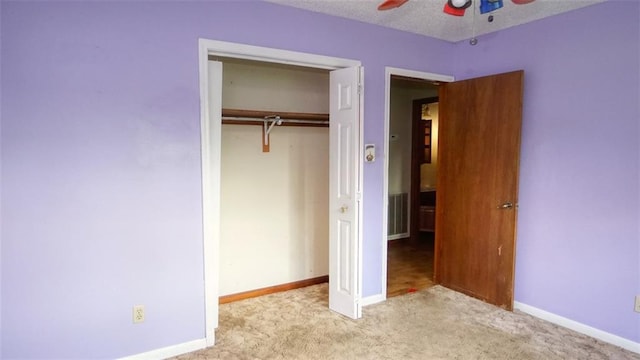 232 Lake Village Blvd, Slidell, LA 70461 - unfurnished bedroom with carpet, a closet, and a ceiling fan