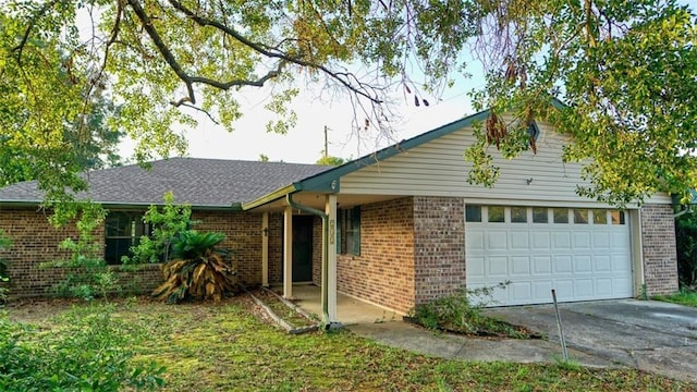 232 Lake Village Blvd, Slidell, LA 70461 - single story home with brick siding, an attached garage, and concrete driveway