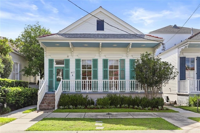 417 Eleonore St, New Orleans, LA 70115 - shotgun-style home with covered porch