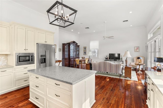 417 Eleonore St, New Orleans, LA 70115 - kitchen with appliances with stainless steel finishes, dark wood-type flooring, a ceiling fan, pendant lighting, and crown molding