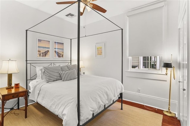 417 Eleonore St, New Orleans, LA 70115 - bedroom with wood finished floors and a ceiling fan