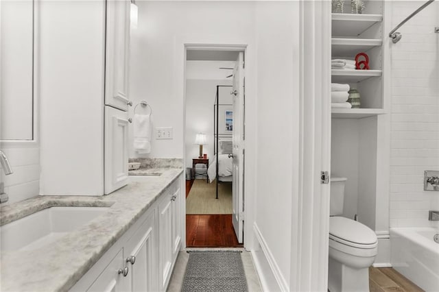 417 Eleonore St, New Orleans, LA 70115 - bathroom with double vanity, shower / tub combination, and wood finished floors