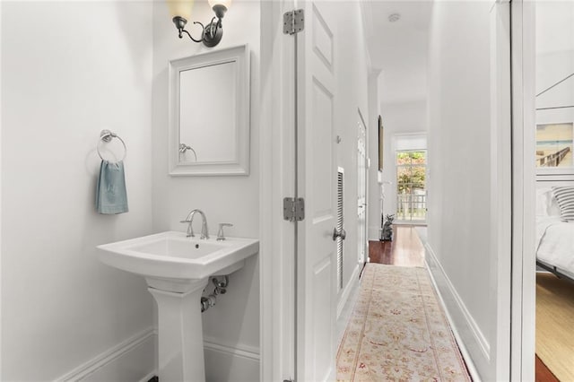 417 Eleonore St, New Orleans, LA 70115 - bathroom featuring wood finished floors and a sink