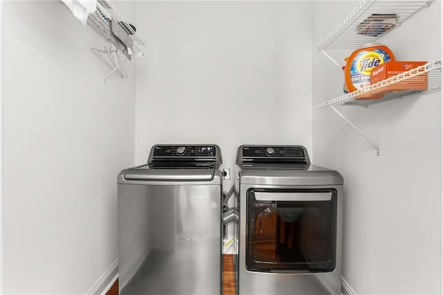 417 Eleonore St, New Orleans, LA 70115 - laundry room with independent washer and dryer and baseboards