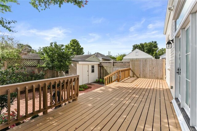 417 Eleonore St, New Orleans, LA 70115 - wooden terrace featuring a storage shed and a fenced backyard