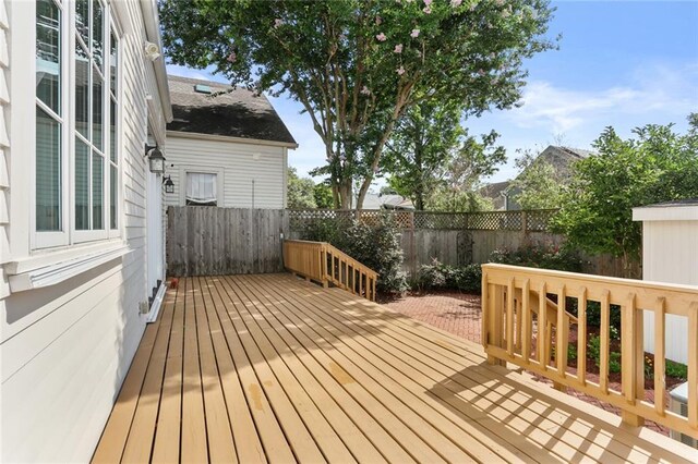 417 Eleonore St, New Orleans, LA 70115 - wooden deck featuring a fenced backyard