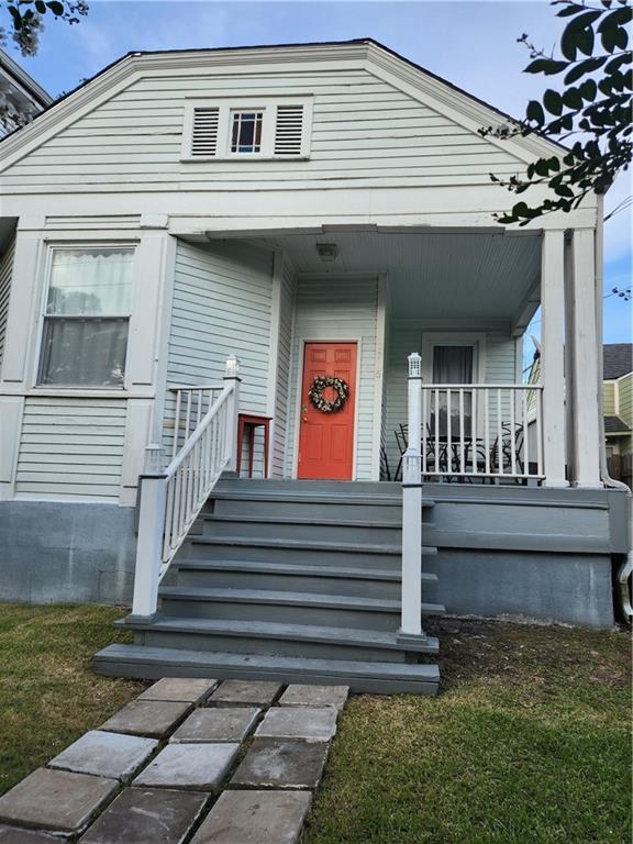 2715 Marengo St, New Orleans, LA 70115 - doorway to property featuring a porch