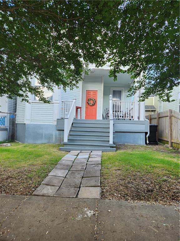 2715 Marengo St, New Orleans, LA 70115 - view of front of home featuring a porch