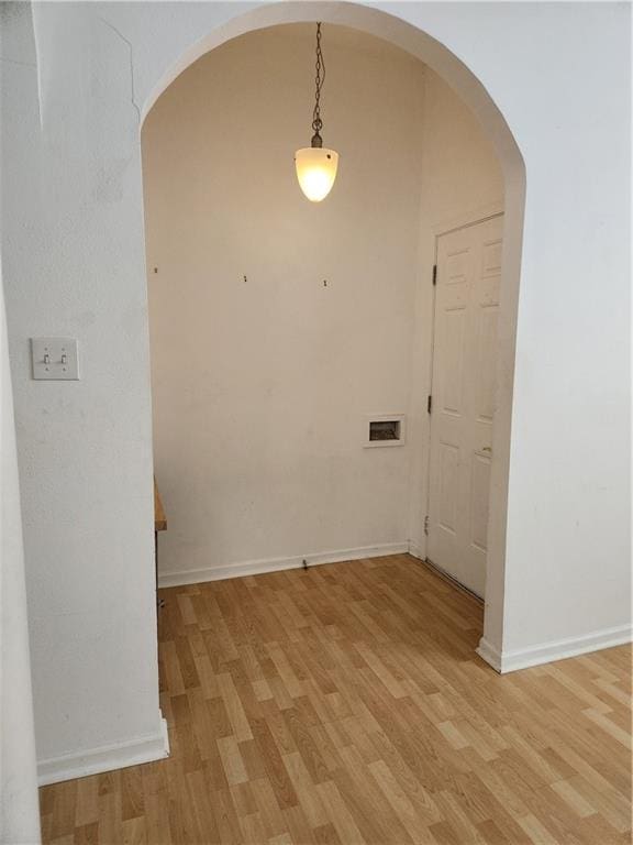 2715 Marengo St, New Orleans, LA 70115 - unfurnished room featuring arched walkways and light wood finished floors