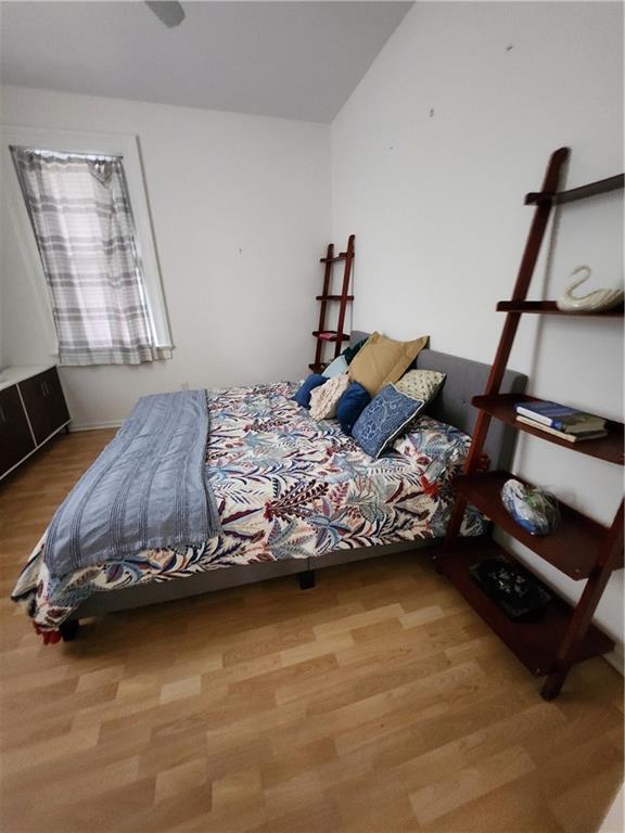 2715 Marengo St, New Orleans, LA 70115 - bedroom with wood finished floors