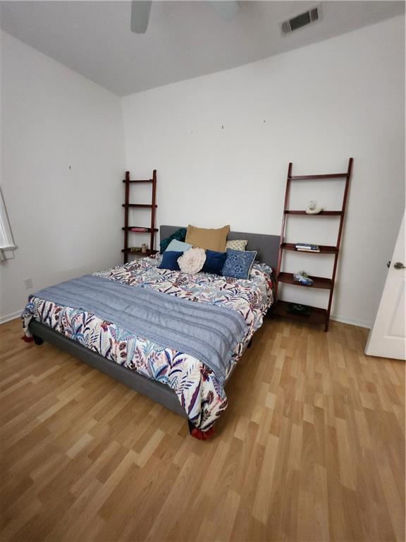 2715 Marengo St, New Orleans, LA 70115 - bedroom featuring wood finished floors and a ceiling fan