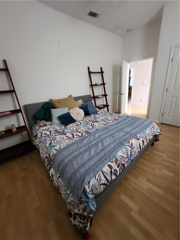 2715 Marengo St, New Orleans, LA 70115 - bedroom with wood finished floors
