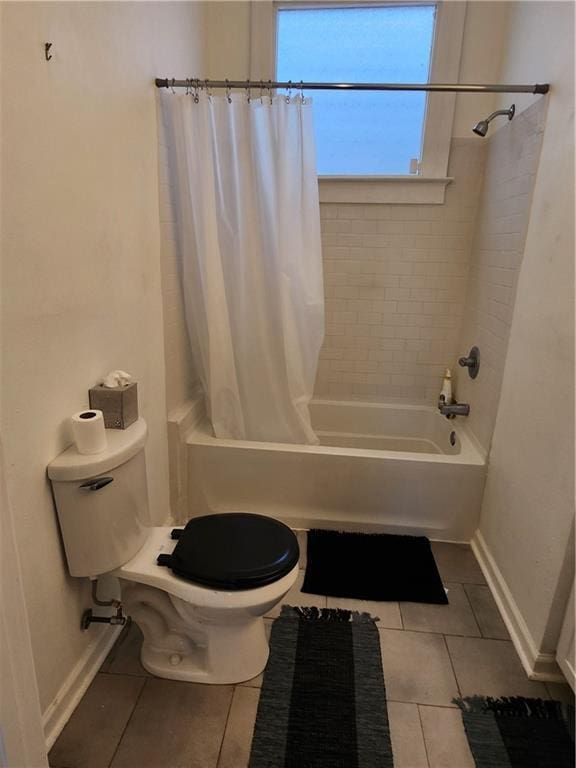 2715 Marengo St, New Orleans, LA 70115 - full bathroom featuring tile patterned floors and shower / bath combination with curtain