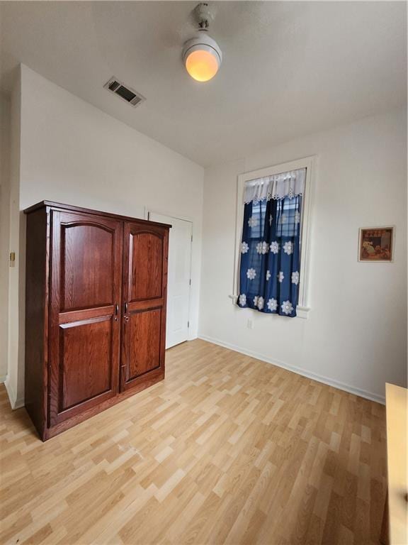 2715 Marengo St, New Orleans, LA 70115 - unfurnished bedroom with light wood-type flooring and baseboards