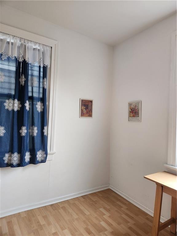 2715 Marengo St, New Orleans, LA 70115 - empty room with wood finished floors