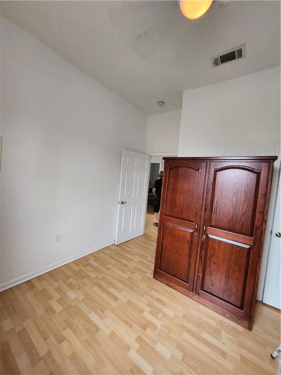 2715 Marengo St, New Orleans, LA 70115 - unfurnished bedroom with light wood-style flooring