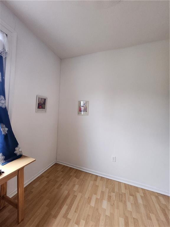 2715 Marengo St, New Orleans, LA 70115 - washroom with light wood-style floors and baseboards