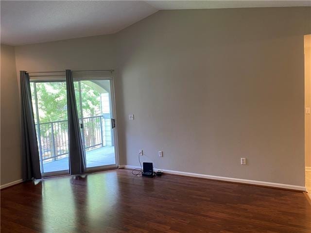 350 Emerald Forest Ave Unit 5202, Covington, LA 70433 - spare room featuring dark wood finished floors and vaulted ceiling