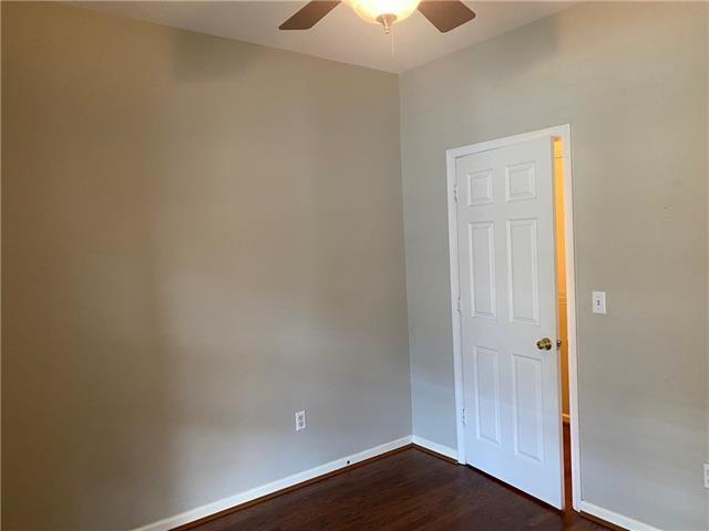 350 Emerald Forest Blvd Unit 5202, Covington, LA 70433 - empty room featuring a ceiling fan and dark wood-style flooring