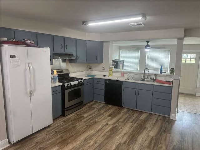 105 Beta St, Belle Chasse, LA 70037 - kitchen featuring freestanding refrigerator, dishwasher, stainless steel gas stove, under cabinet range hood, and dark wood finished floors