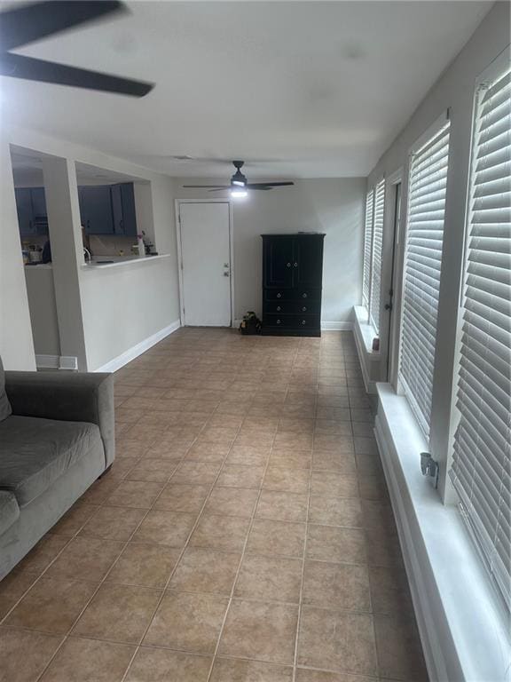 105 Beta St, Belle Chasse, LA 70037 - unfurnished living room featuring ceiling fan and tile patterned floors