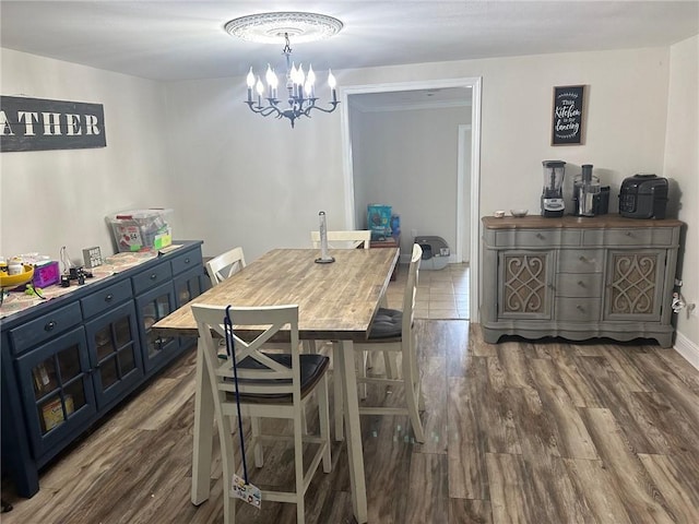 105 Beta St, Belle Chasse, LA 70037 - dining space featuring a chandelier and wood finished floors