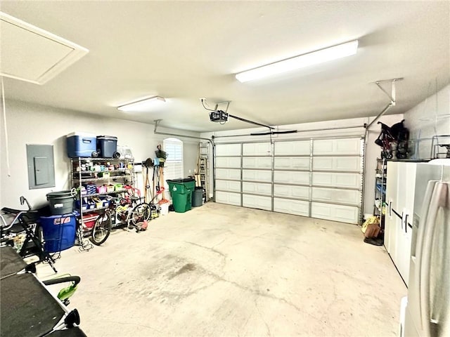 246 S Orchard Ln, Covington, LA 70433 - garage with electric panel and a garage door opener