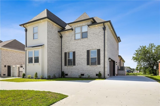 59 Oak Tree Dr, Slidell, LA 70458 - view of front of house with crawl space, brick siding, driveway, and an attached garage