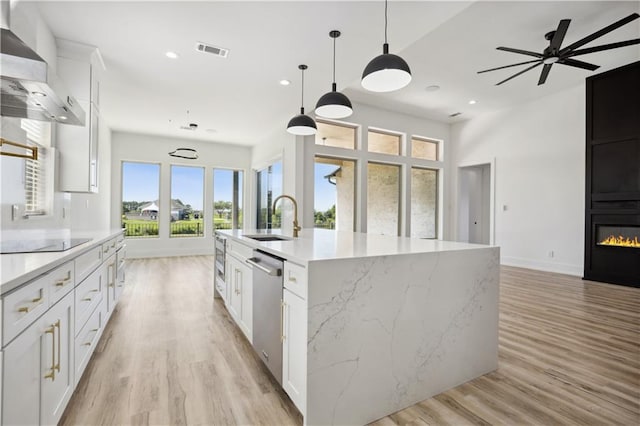 59 Oak Tree Dr, Slidell, LA 70458 - kitchen featuring wall chimney exhaust hood, black electric cooktop, dishwasher, open floor plan, and recessed lighting