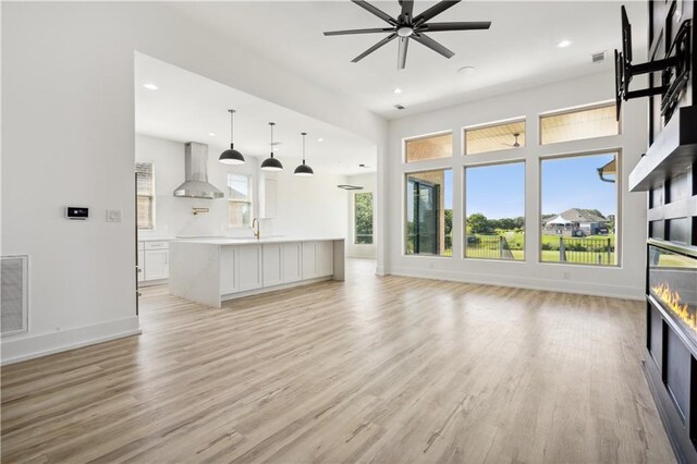 59 Oak Tree Dr, Slidell, LA 70458 - unfurnished living room with light wood-style floors, recessed lighting, and ceiling fan