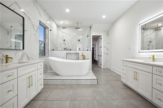 59 Oak Tree Dr, Slidell, LA 70458 - bathroom featuring a marble finish shower, two vanities, a freestanding bath, and recessed lighting
