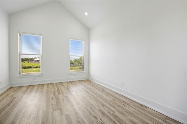 59 Oak Tree Dr, Slidell, LA 70458 - spare room with light wood finished floors, recessed lighting, and high vaulted ceiling