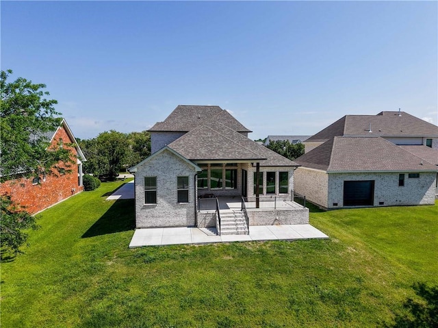 59 Oak Tree Dr, Slidell, LA 70458 - back of house with a patio, a lawn, brick siding, and a shingled roof