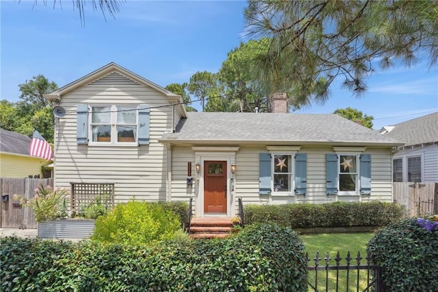 223840 Dante St, New Orleans, LA 70118 - view of front facade featuring a chimney and a shingled roof