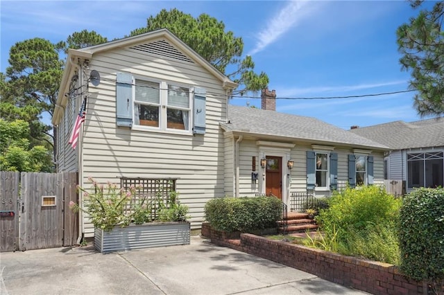 223840 Dante St, New Orleans, LA 70118 - view of front of house with a chimney and a patio