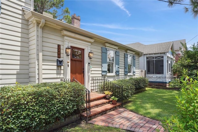 223840 Dante St, New Orleans, LA 70118 - property entrance with a chimney and a lawn
