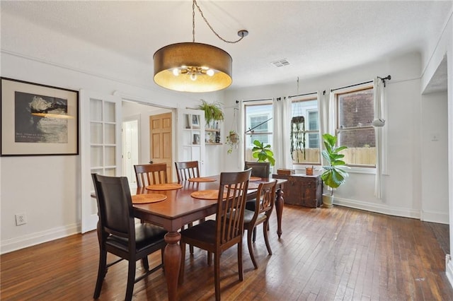 223840 Dante St, New Orleans, LA 70118 - dining room featuring hardwood / wood-style flooring and a textured ceiling