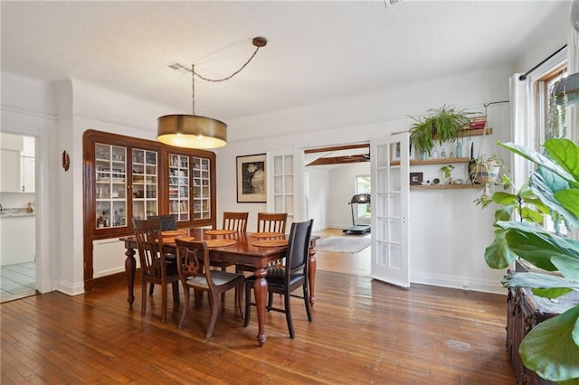 223840 Dante St, New Orleans, LA 70118 - dining space featuring wood-type flooring and french doors