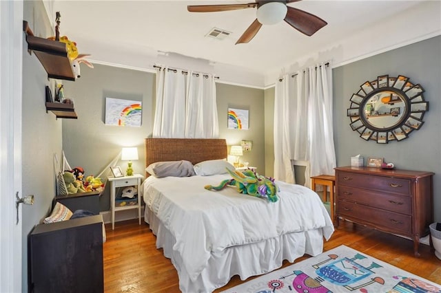 223840 Dante St, New Orleans, LA 70118 - bedroom featuring wood finished floors and ceiling fan