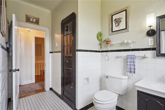 223840 Dante St, New Orleans, LA 70118 - bathroom with tile walls, vanity, and a wainscoted wall